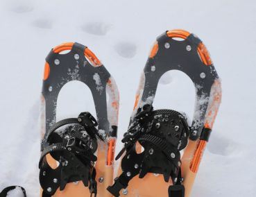 Orange snowshoes in snow